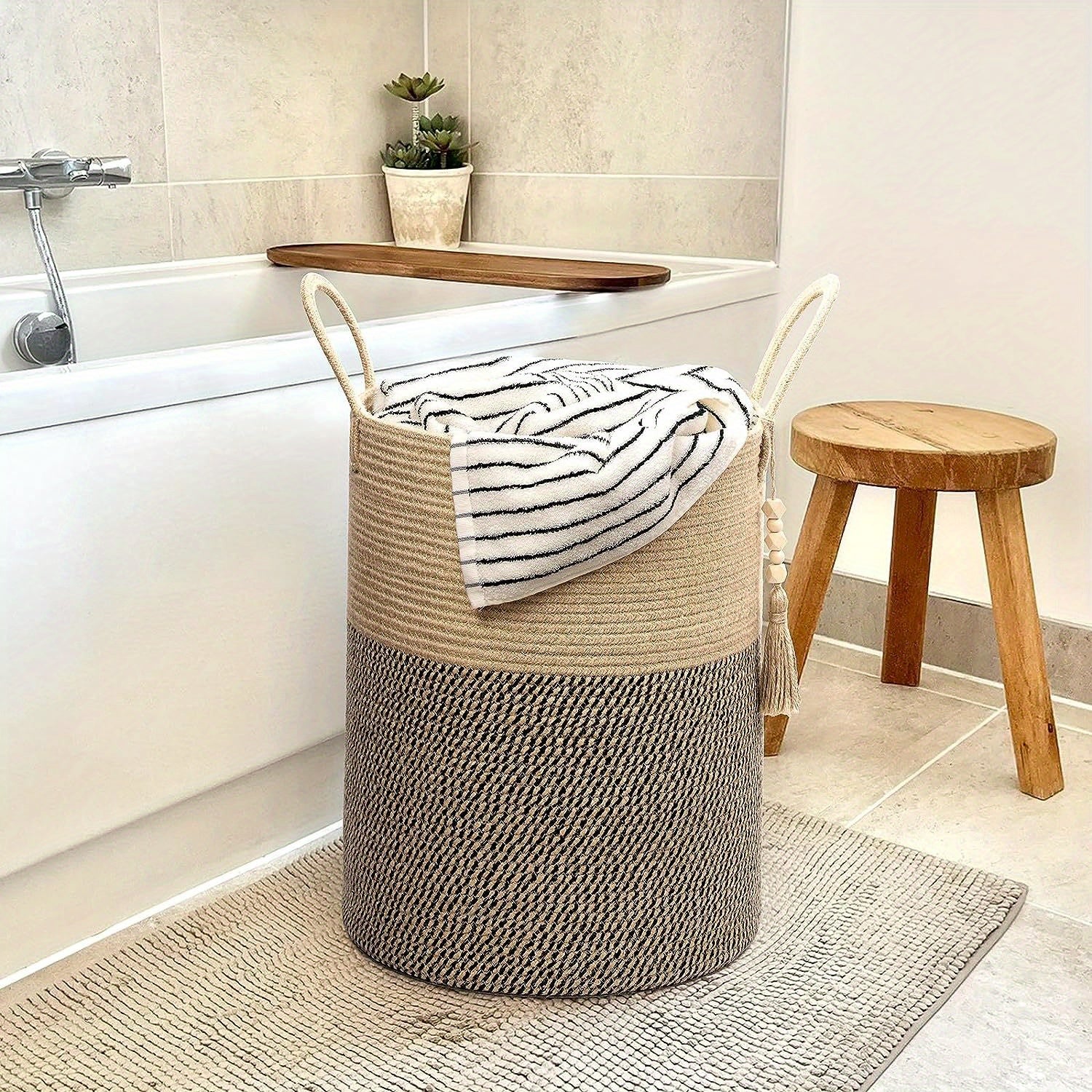 Foldable storage basket with beige and black handles 