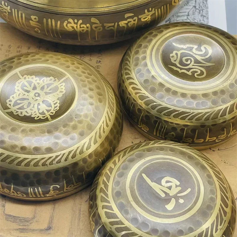 Tibetan meditation bowls engraved with a leather stick 