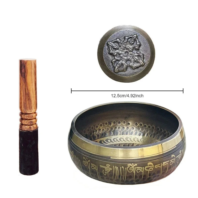 Tibetan meditation bowls engraved with a leather stick 