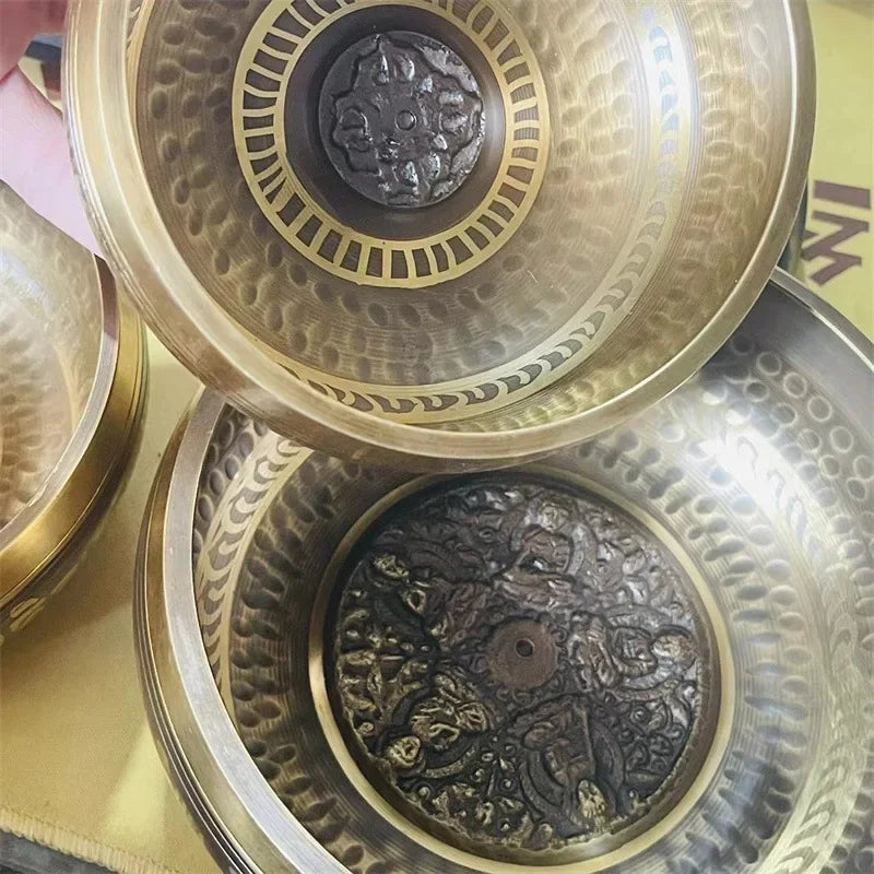 Tibetan meditation bowls engraved with a leather stick 