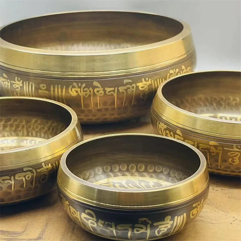 Tibetan meditation bowls engraved with a leather stick 