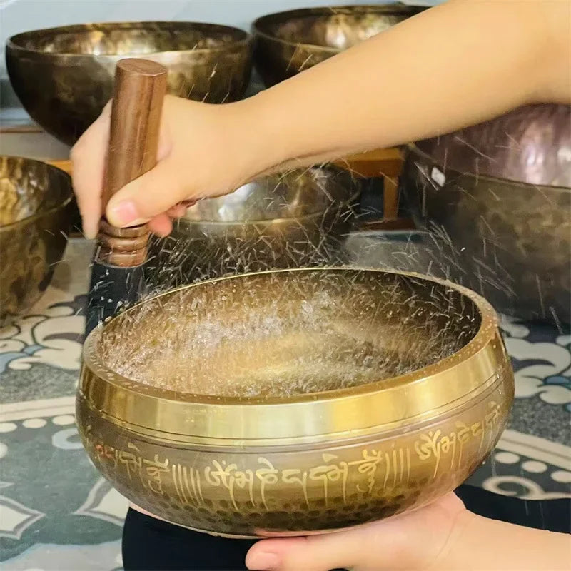 Tibetan meditation bowls engraved with a leather stick 